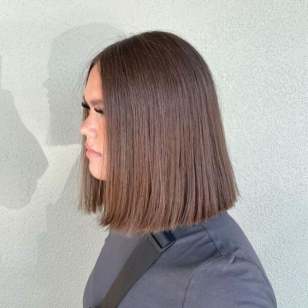 Blunt Chocolate Brown Long Bob - a woman wearing gray shirt