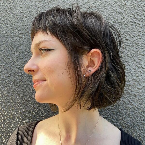 Blunt Textured Bob with Bangs - a woman wearing basic tees