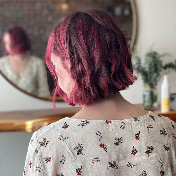 A woman wearing cream floral top