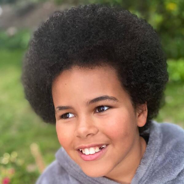 Coiled Ball Afro - a girl is wearing jacket