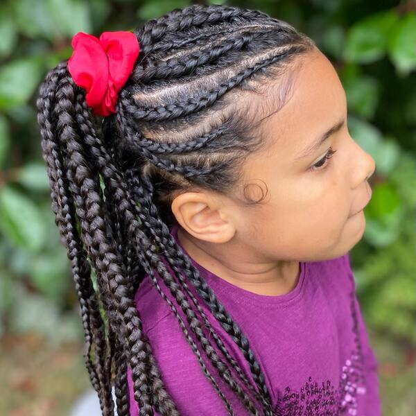 Cornrow Braids on Side Ponytail - a girl is wearing purple sweater