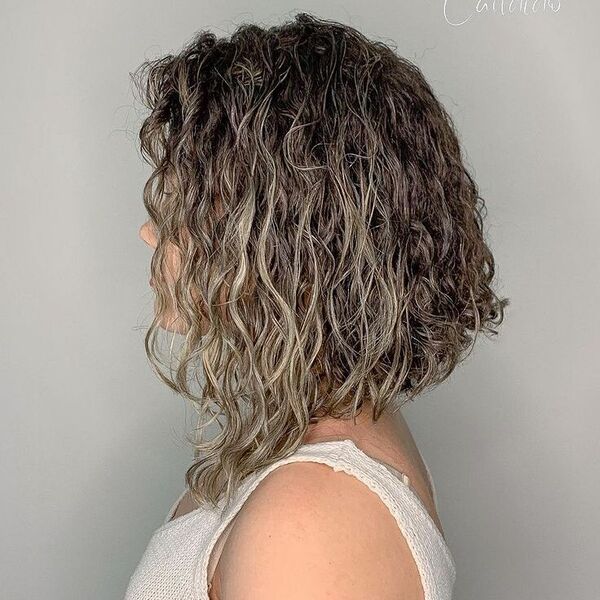 Curly A-line Long Bob Ombre - a woman wearing white tank top