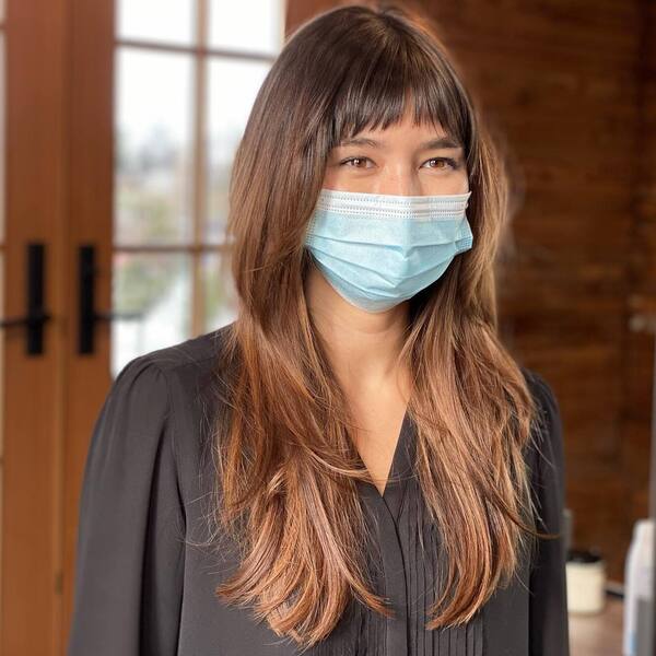 A woman wearing black long sleeves blouse