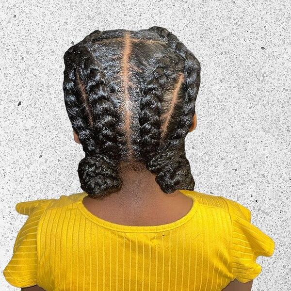 Double Braided Cornrows - a girl is wearing yellow top