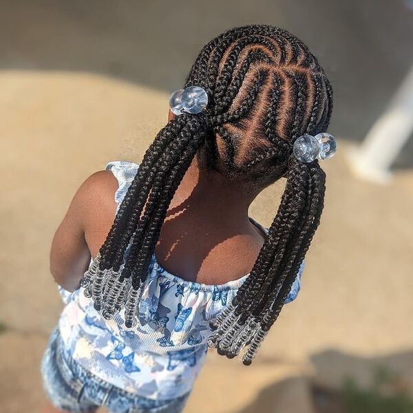 Double Pony Weave Braids - a girl is wearing blue floral top