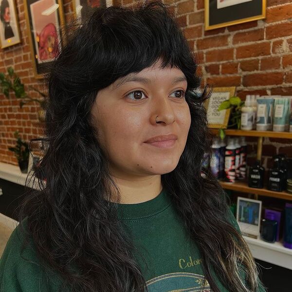 A woman wearing green printed shirt