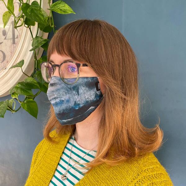 Fly Away Curtain Bangs Short Hair - a woman wearing yellow cardigan