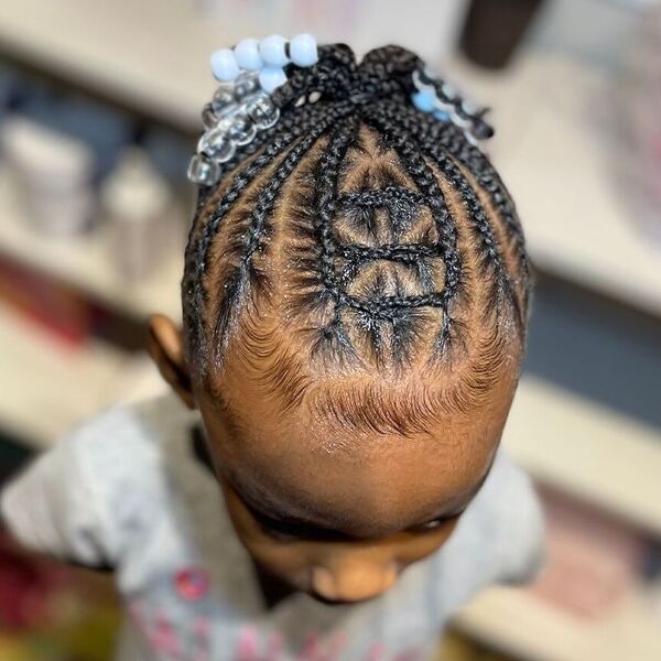 Intricate Braided Pony - a girl wearing is wearing printed top