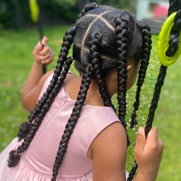 Jumbo Box Braids - a girl wearing pink dress