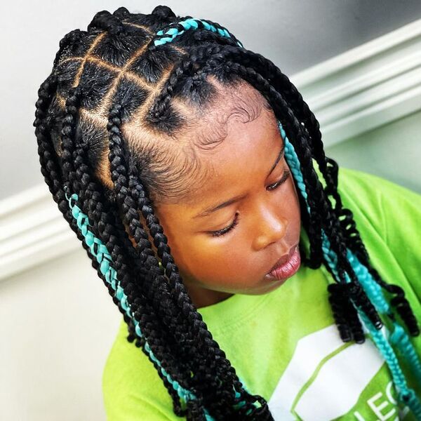 Knotless Box Braids with Curl Ends - a girl is wearing green shirt