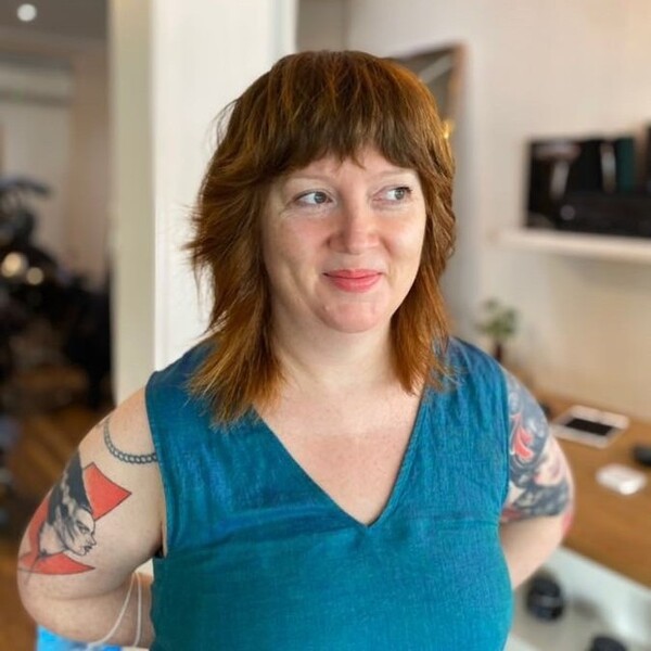 Layer Caramel Hair and Fringes - a woman wearing blue sleeveless