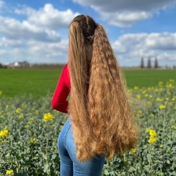 A woman waring red long sleeves