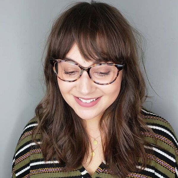 Medium Hair Choppy Fringe - a woman wearing stripe top