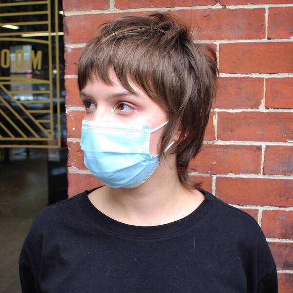 Mini Shag Short Mullet - a woman wearing plain black shirt with mask