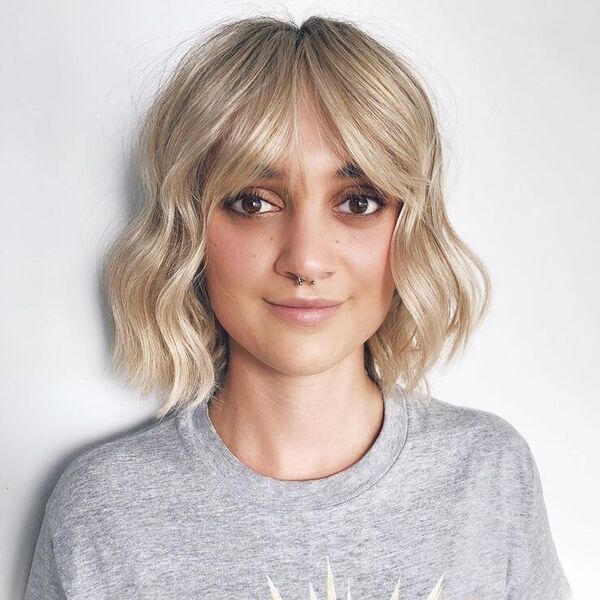 Parted Shag Blonde Fringe Bob - a woman wearing gray shirt