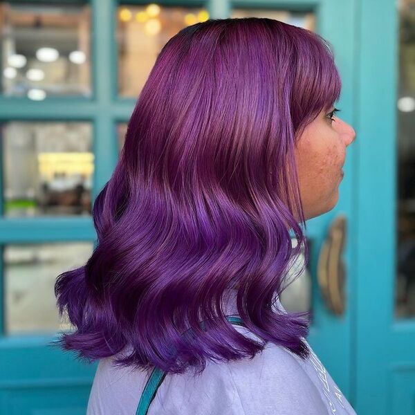 Purple Sombre Long Bob with Bangs - a woman wearing purple shirt