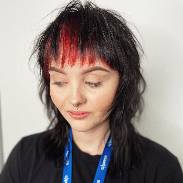 Razor Mullet with Red Fringes - a woman wearing black shirt with lanyard