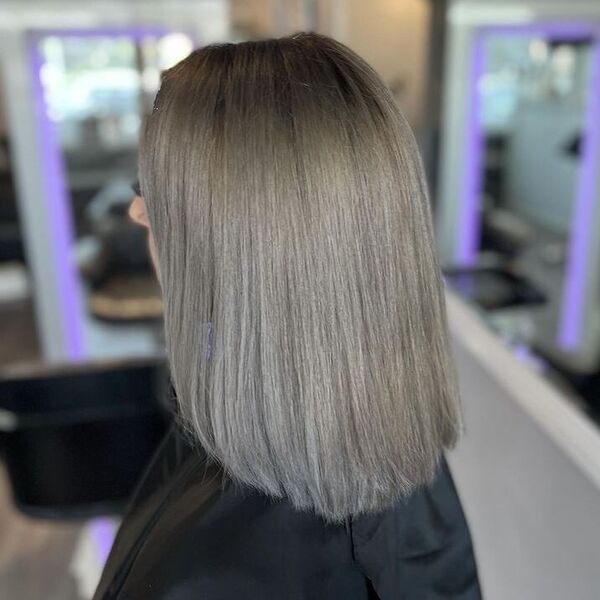 Root Smudge Long Lob in Ash Gray - a woman wearing black cape