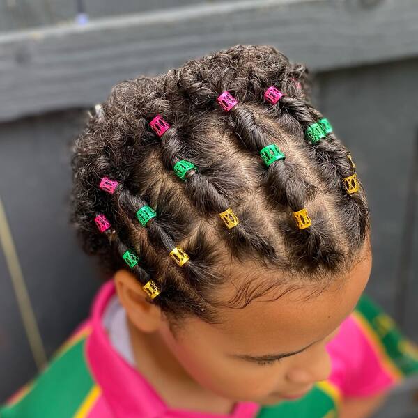 Rubber Band Twists Braids - a girl is wearing green pink polo