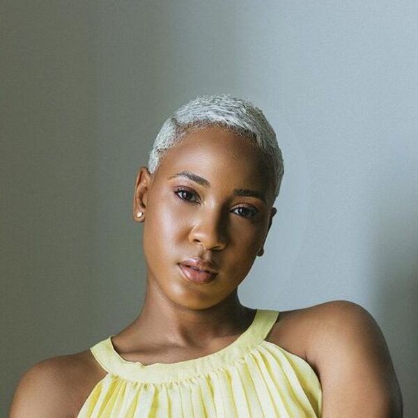 A woman wearing yellow blouse