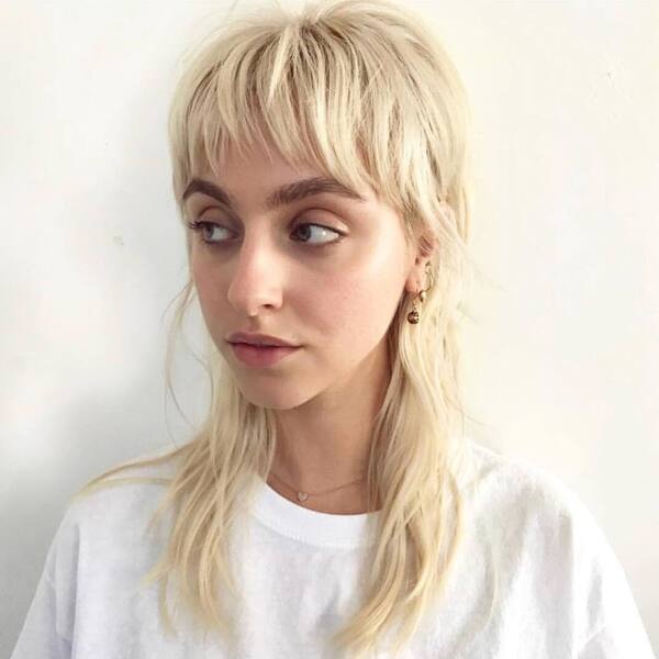 Shag Bangs in Mullet - a woman wearing white loose shirt