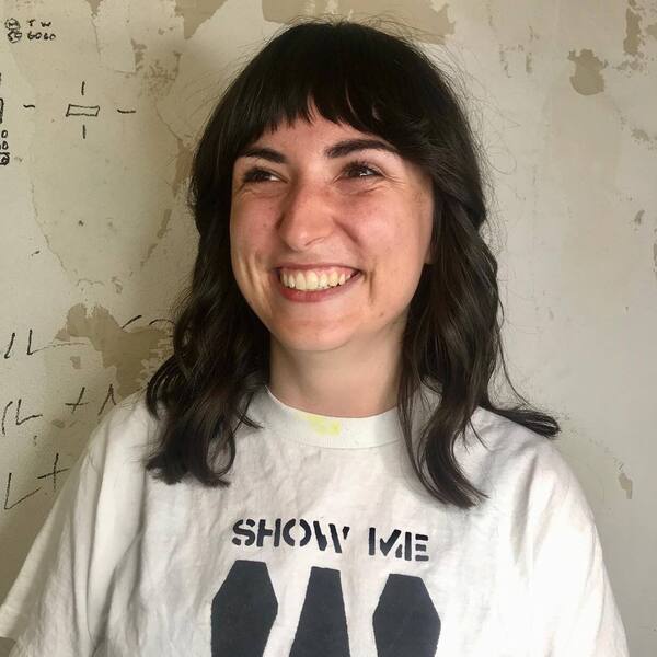 Shaggy Short Fringe - a woman wearing white shirt