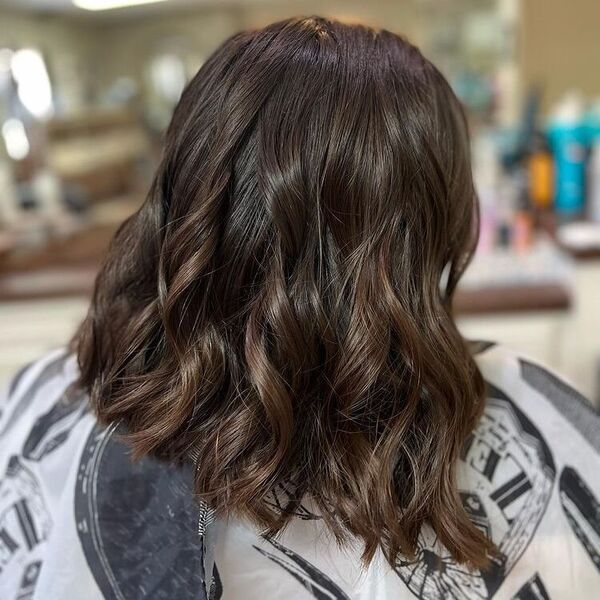 Shiny Dark Brown Long Bob -a woman wearing printed cape