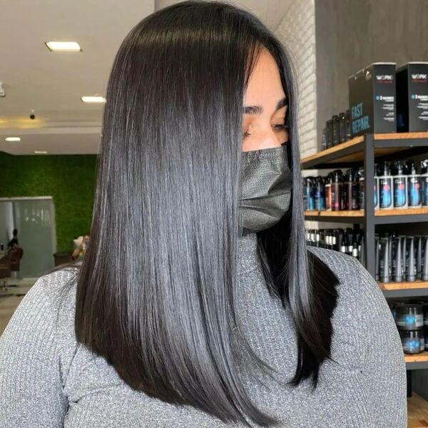 Shiny Hair Long Bob - a woman wearing gray shirt with mask