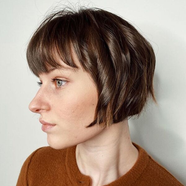 Short Bob Shag Fringe - a woman wearing brown shirt