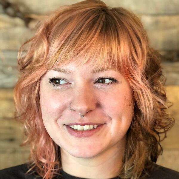 Soft Pink Shag Fringe - a woman wearing black shirt