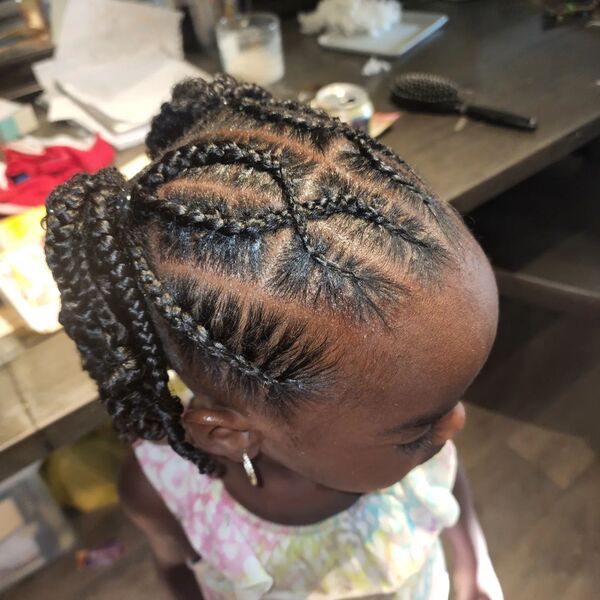 Stitch Cornrows in Ponytails - a girl is wearing off shoulder top