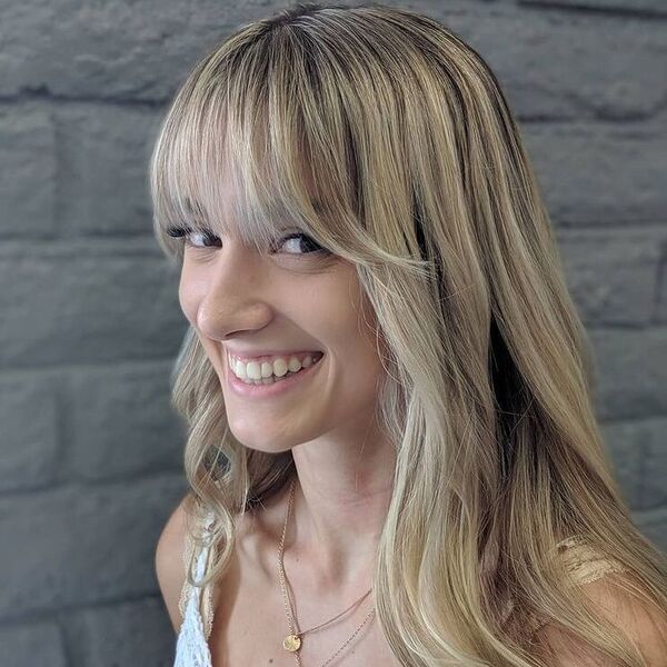 Straight Shag Fringe on Long Hair - a woman wearing lacey top