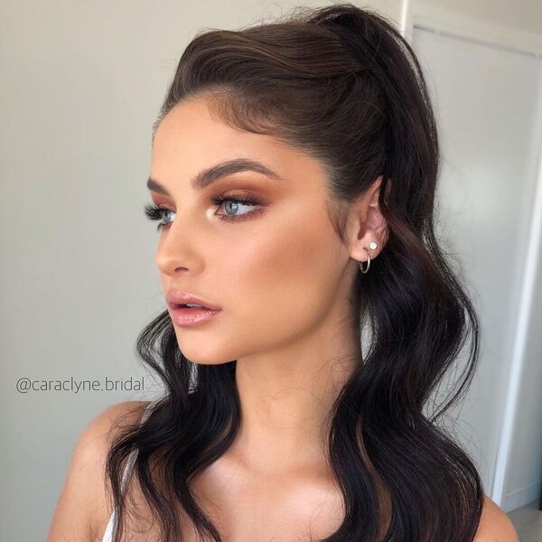 A woman wearing full glam make up