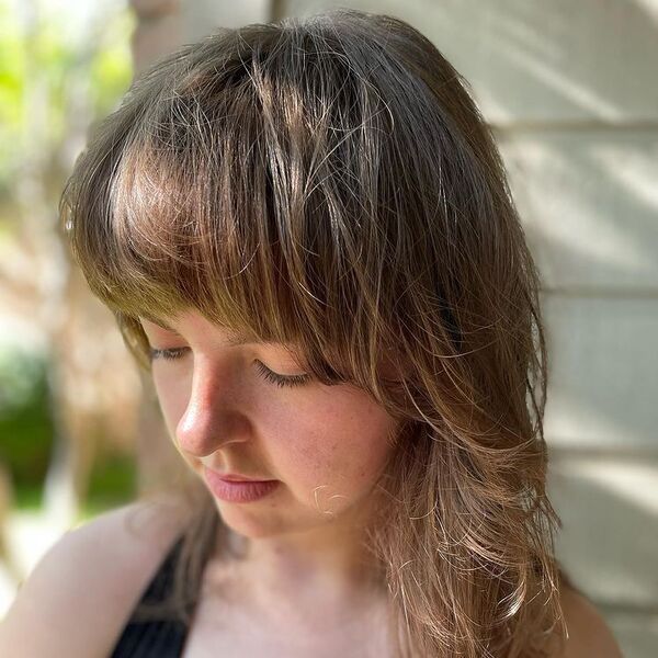 A woman wearing black tank top