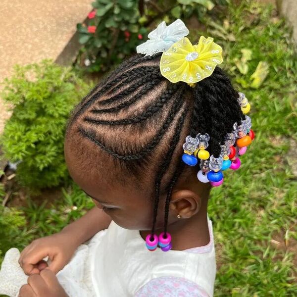 Twisted Fulani Braids - a girl wearing a white dress